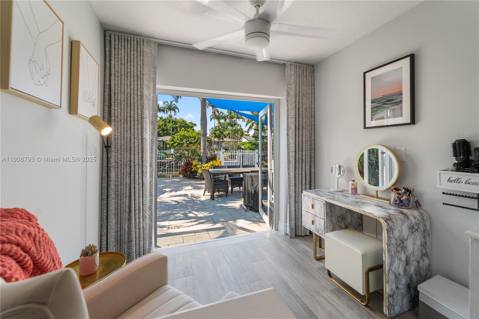4011 Northeast 26th Avenue Lighthouse Point, FL 33064 - Photo 20 of 35 a living room with furniture a fireplace and a window