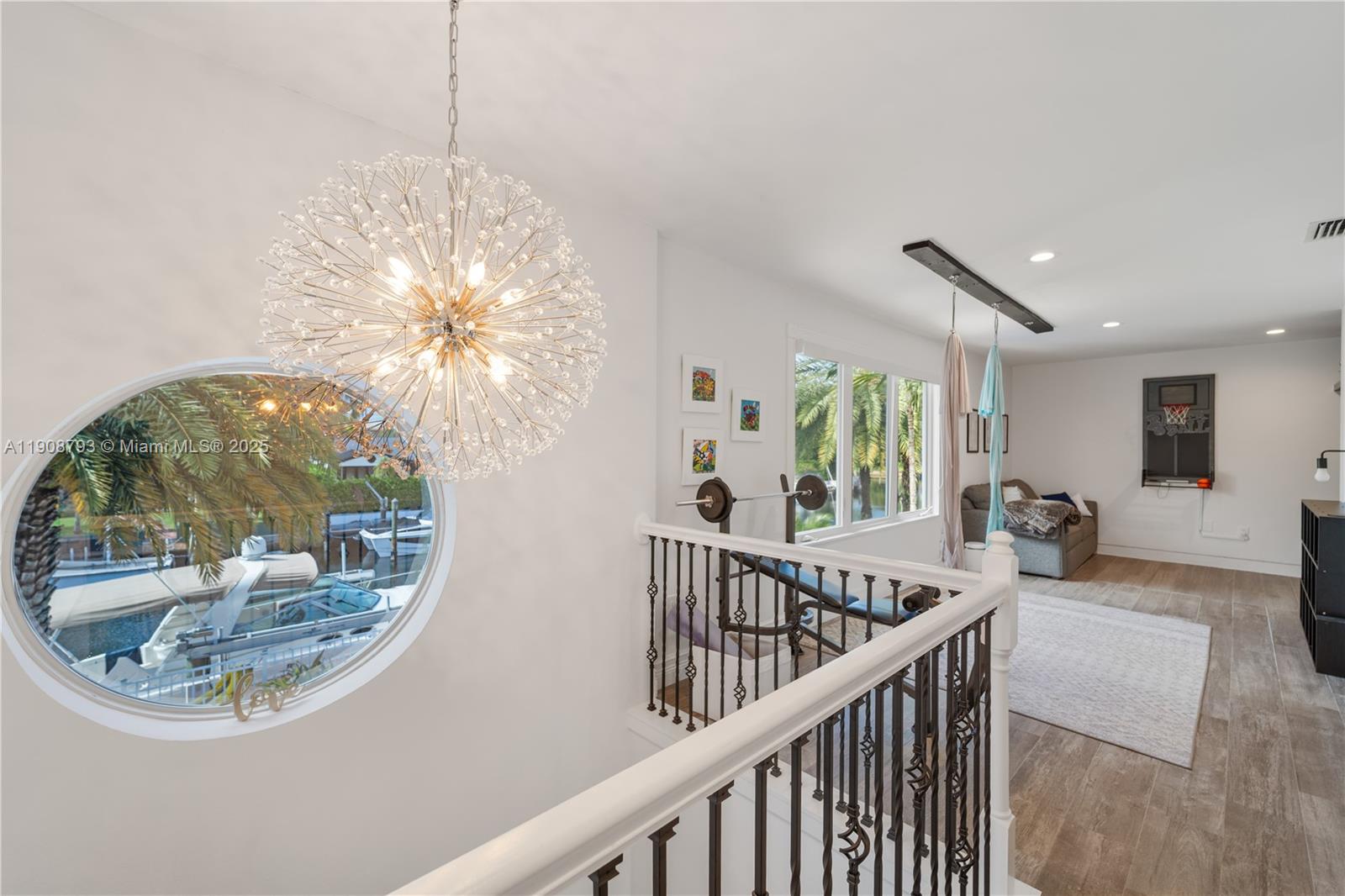 4011 Northeast 26th Avenue Lighthouse Point, FL 33064 - Photo 28 of 35 a view of a livingroom with furniture wooden floor and windows