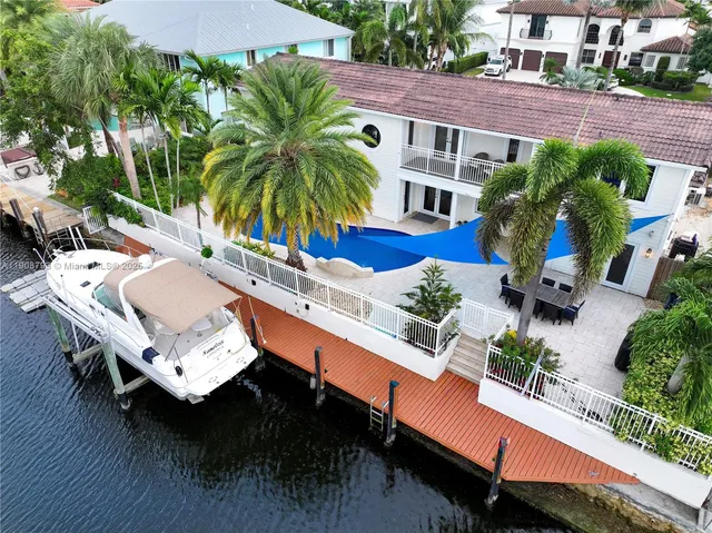 a view of a chairs and table in the patio