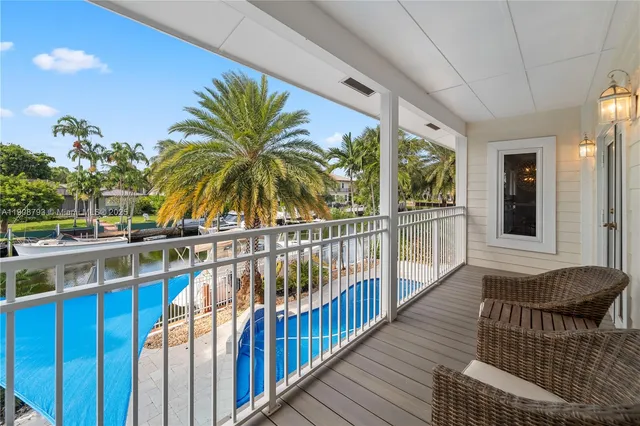 a view of balcony with furniture