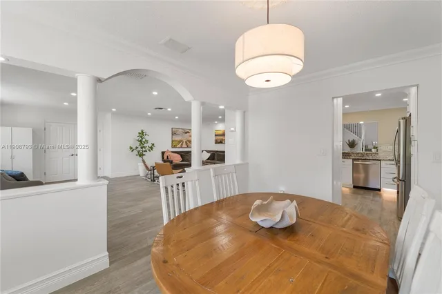 a view of a kitchen and dining room