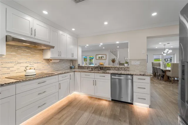 a large kitchen with granite countertop lots of counter top space