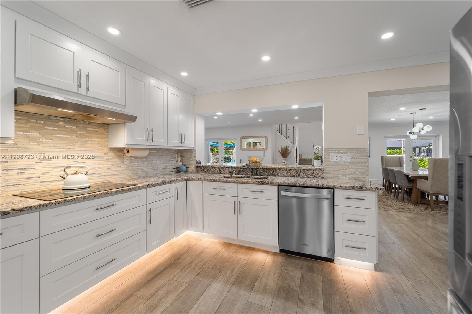 4011 Northeast 26th Avenue Lighthouse Point, FL 33064 - Photo 9 of 35 a large kitchen with granite countertop lots of counter top space