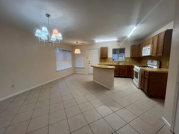 a kitchen with stainless steel appliances granite countertop a sink and cabinets