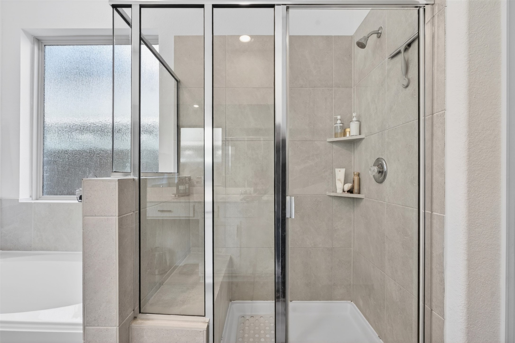 2832 Mistygate Court Conroe, TX 77301 - Photo 18 of 50 Large walk-in shower located in the primary bathroom, offering a spacious and comfortable design for everyday convenience.