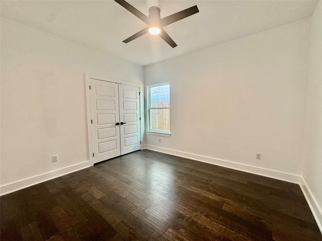 6928 Paris Street, Unit A Houston, TX 77021 - Photo 17 of 20 an empty room with wooden floor and windows