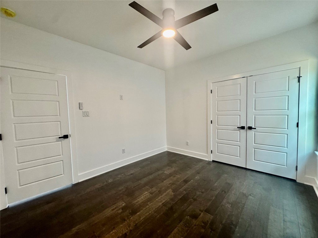 6928 Paris Street, Unit A Houston, TX 77021 - Photo 18 of 20 an empty room with wooden floor closet and windows