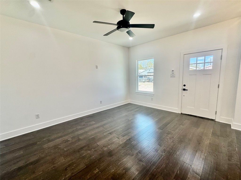 6928 Paris Street, Unit A Houston, TX 77021 - Photo 2 of 20 an empty room with wooden floor and windows