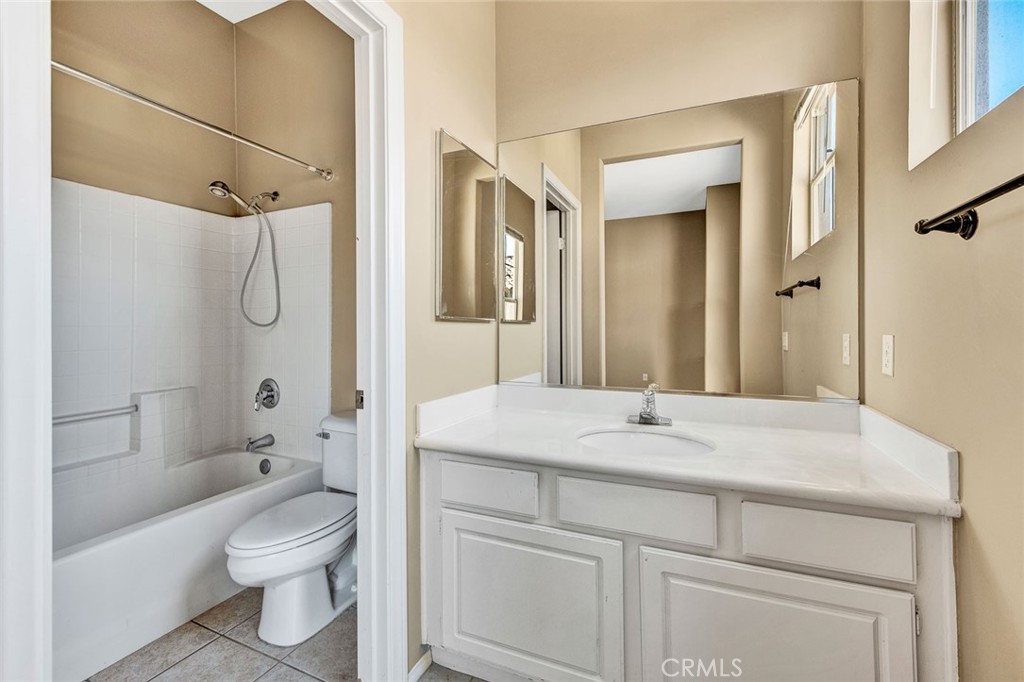 2830 Ballesteros Lane Tustin, CA 92782 - Photo 13 of 28 a bathroom with a sink toilet vanity and shower
