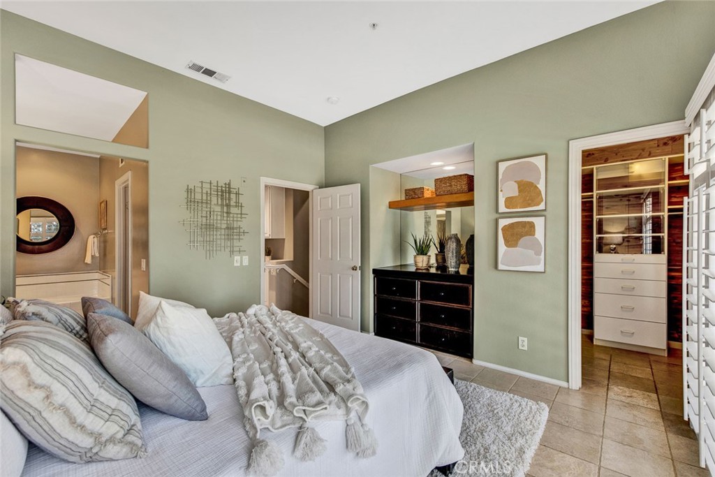 2830 Ballesteros Lane Tustin, CA 92782 - Photo 9 of 28 a bedroom with a bed and dresser with mirror