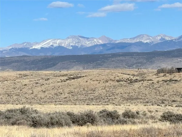 a view of ocean with a mountain