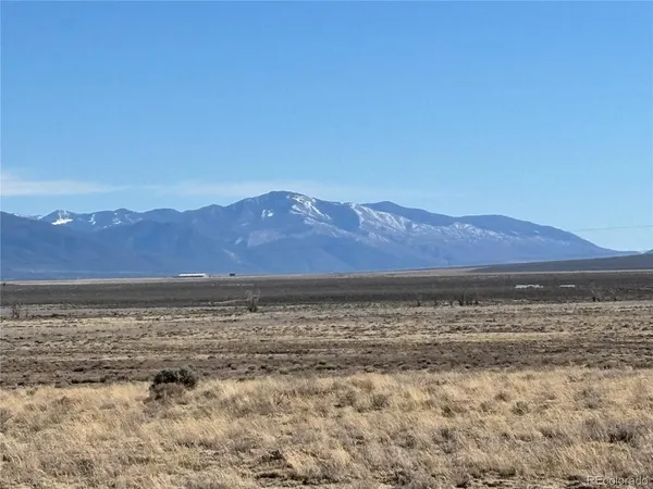 a view of an ocean and a mountain