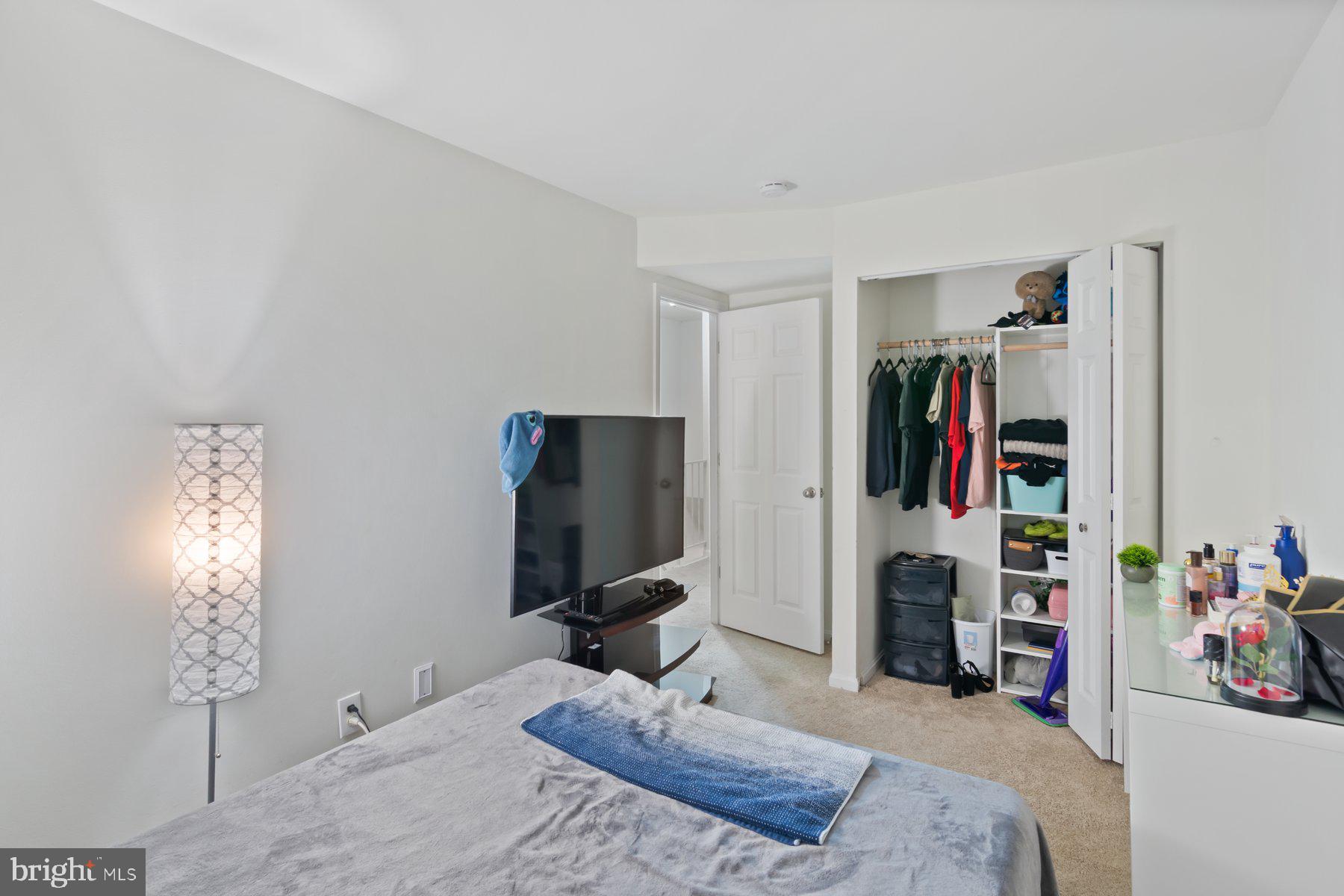 584 Cotswold Court Frederick, MD 21703 - Photo 15 of 21 a bedroom with a bed and a flat screen tv