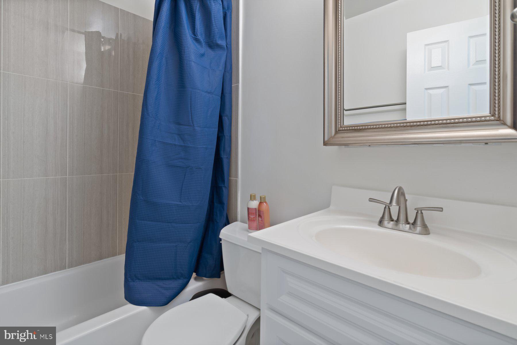 584 Cotswold Court Frederick, MD 21703 - Photo 16 of 21 a bathroom with a sink a toilet and shower