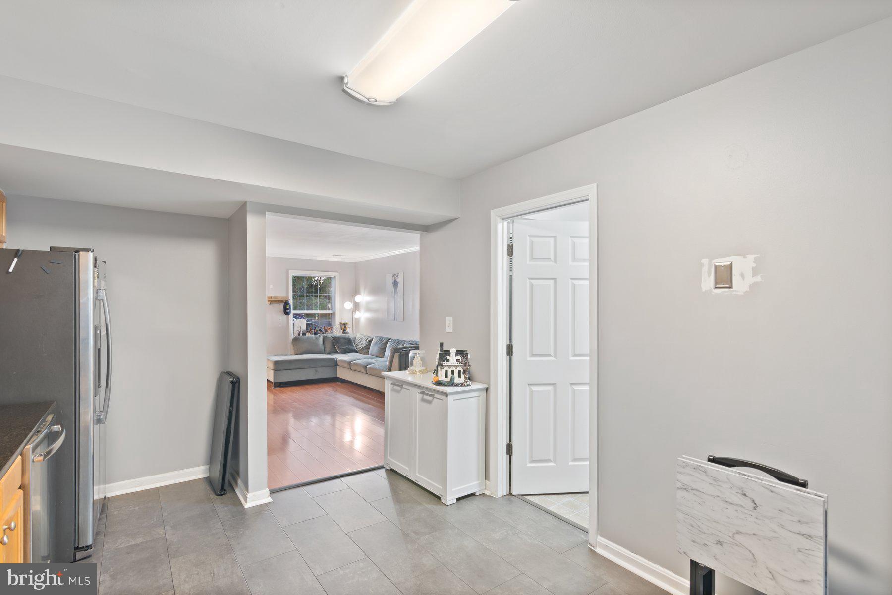 584 Cotswold Court Frederick, MD 21703 - Photo 8 of 21 a view of a living room and a kitchen