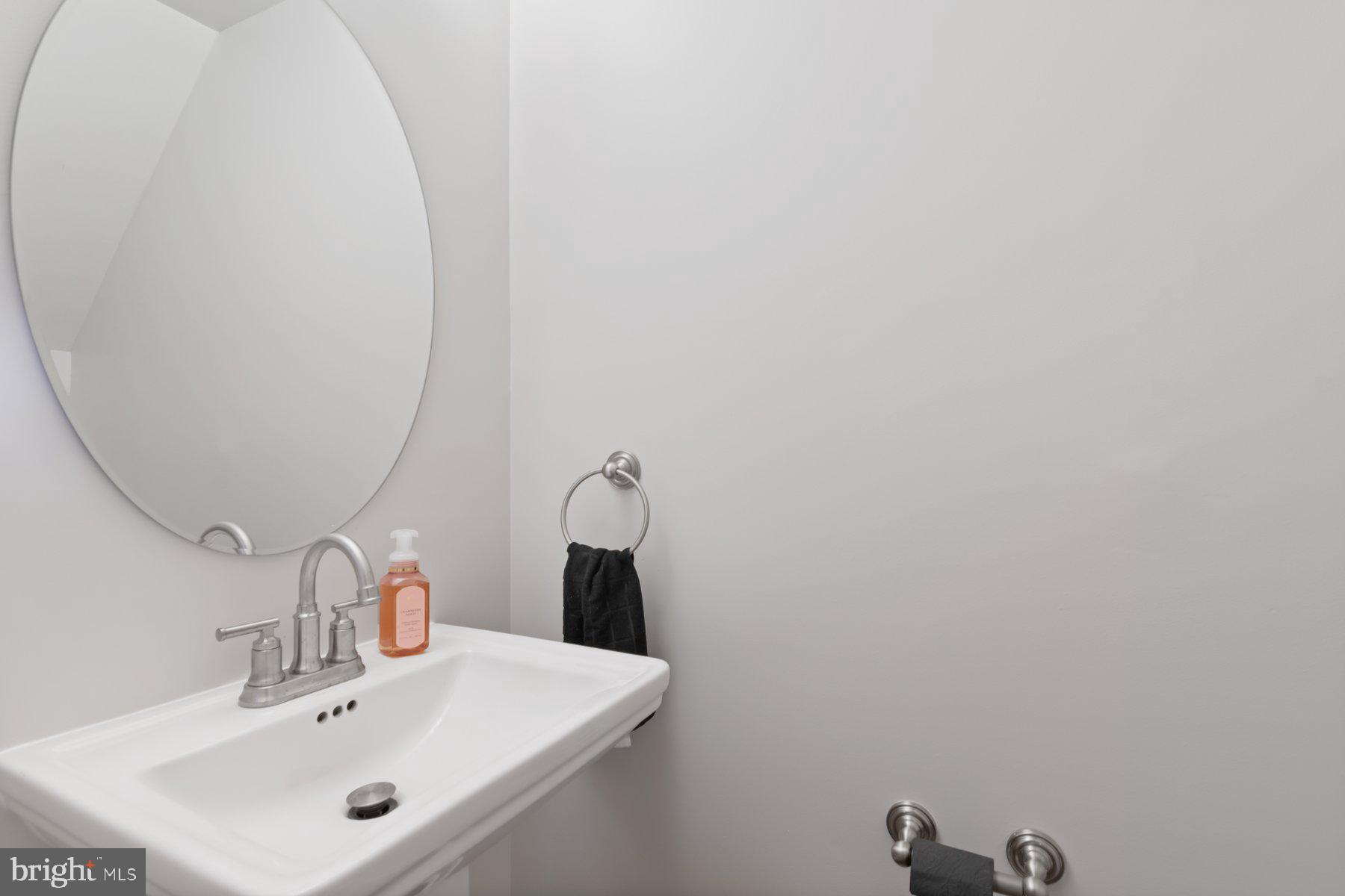 584 Cotswold Court Frederick, MD 21703 - Photo 9 of 21 a bathroom with a sink and mirror
