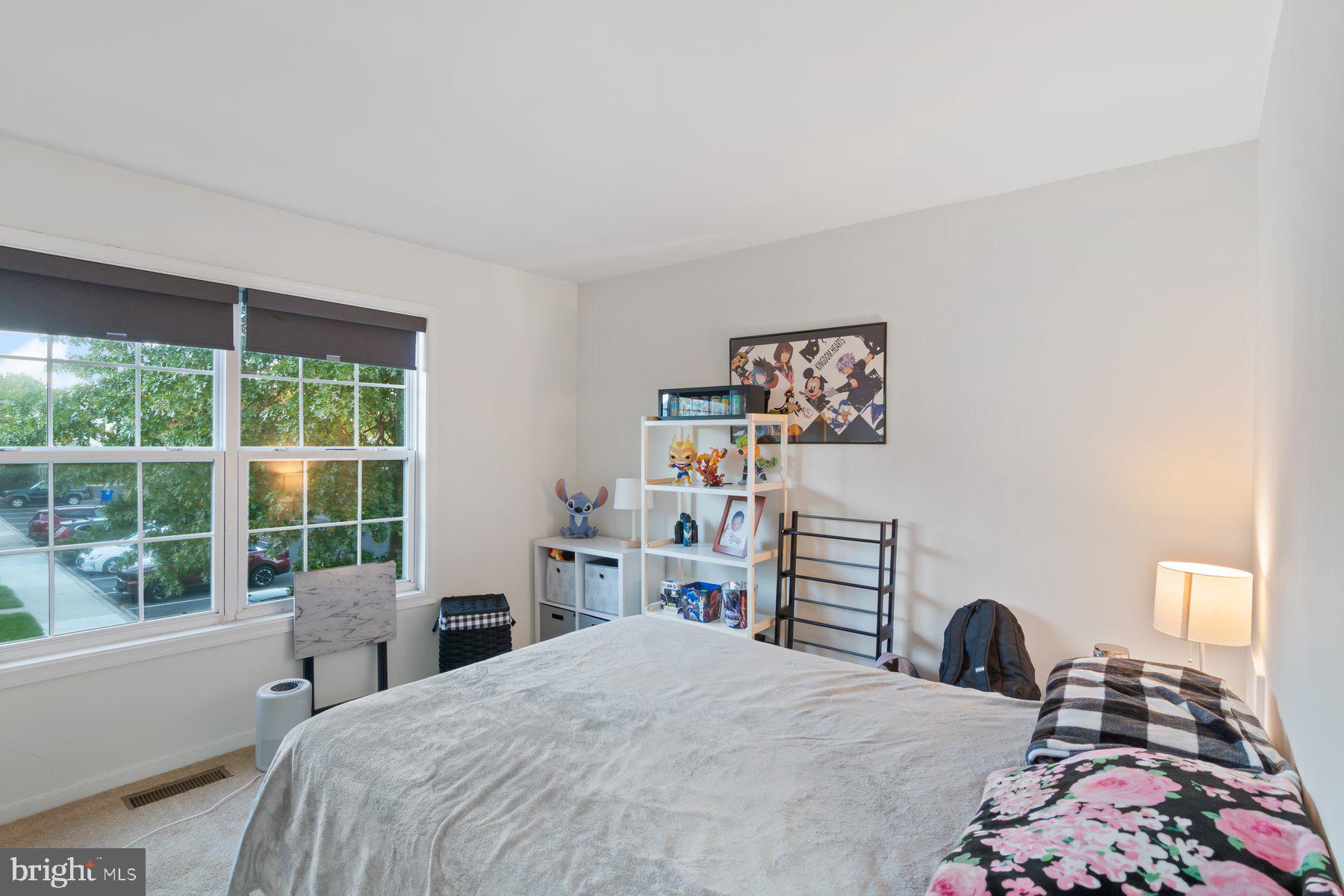 584 Cotswold Court Frederick, MD 21703 - Photo 10 of 21 a bedroom with a bed and a large window