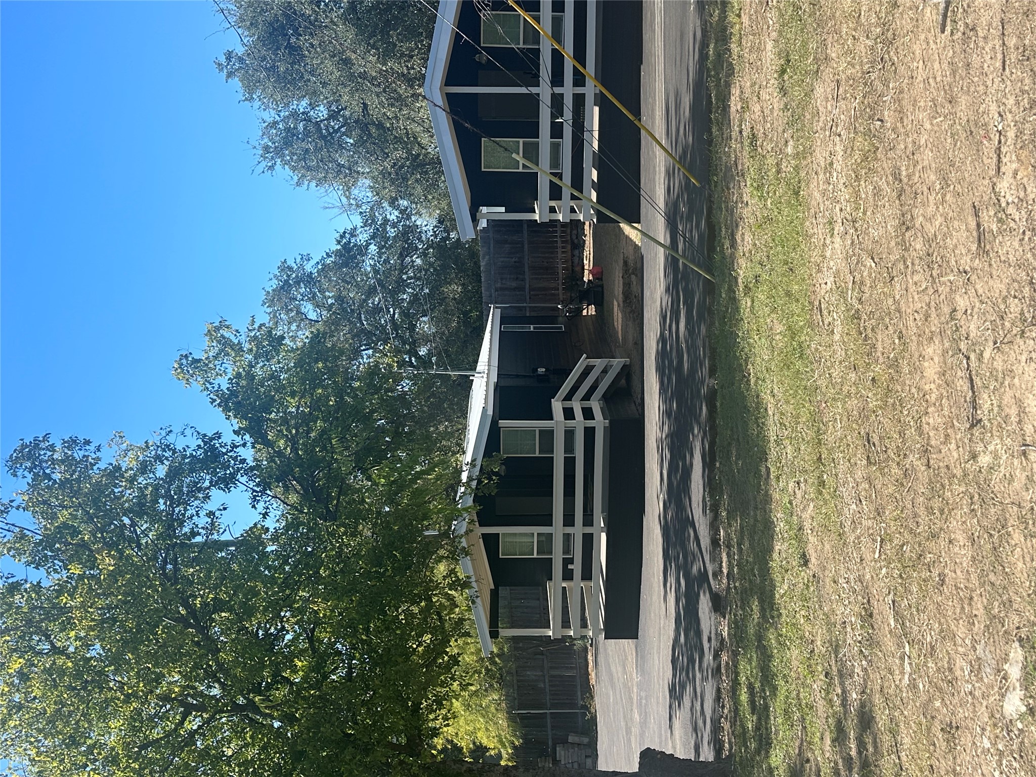 a view of a swimming pool with a chair and tables