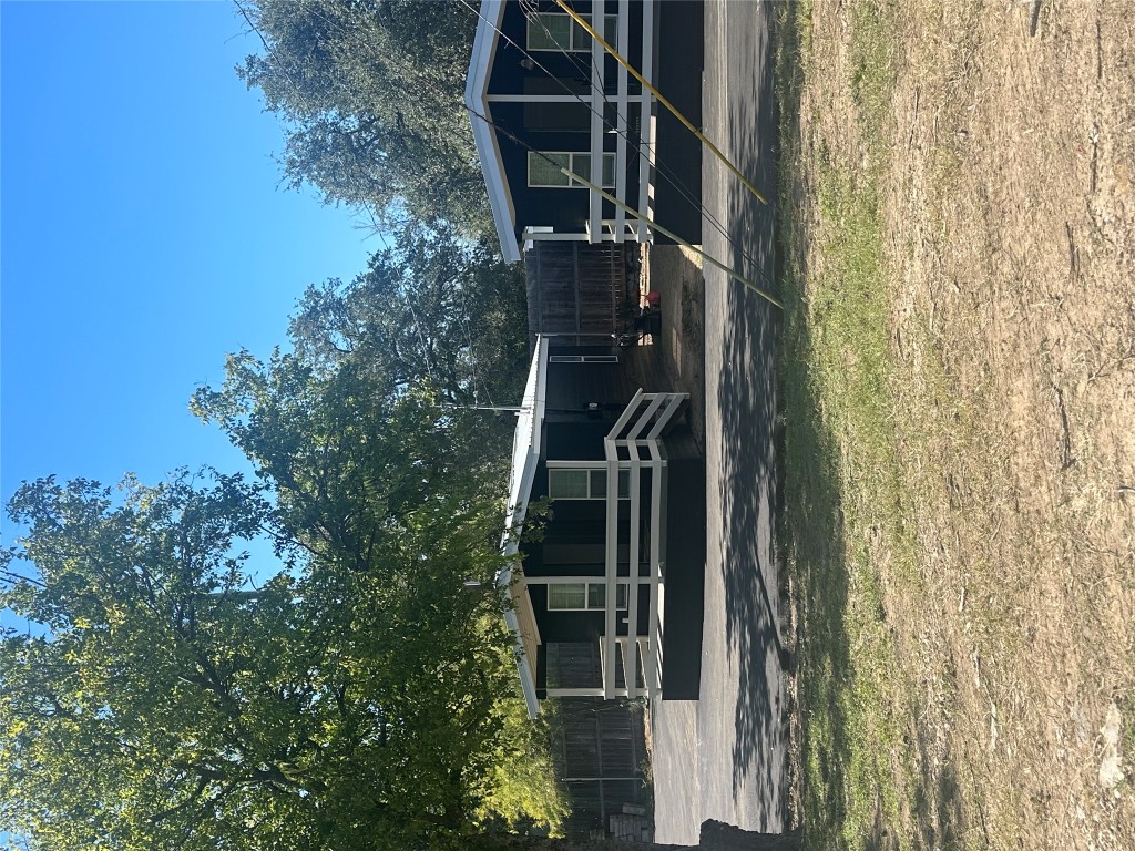 a view of a swimming pool with a chair and tables
