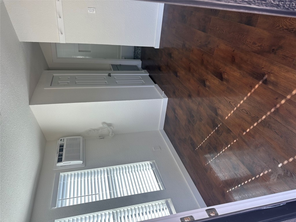 3019 East 12th Street Austin, TX 78702 - Photo 2 of 12 an empty room with wooden floor and windows
