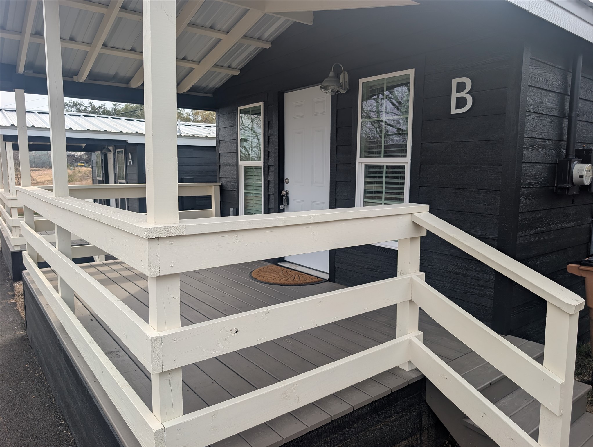 3019 East 12th Street Austin, TX 78702 - Photo 3 of 12 a view of a white building with many windows