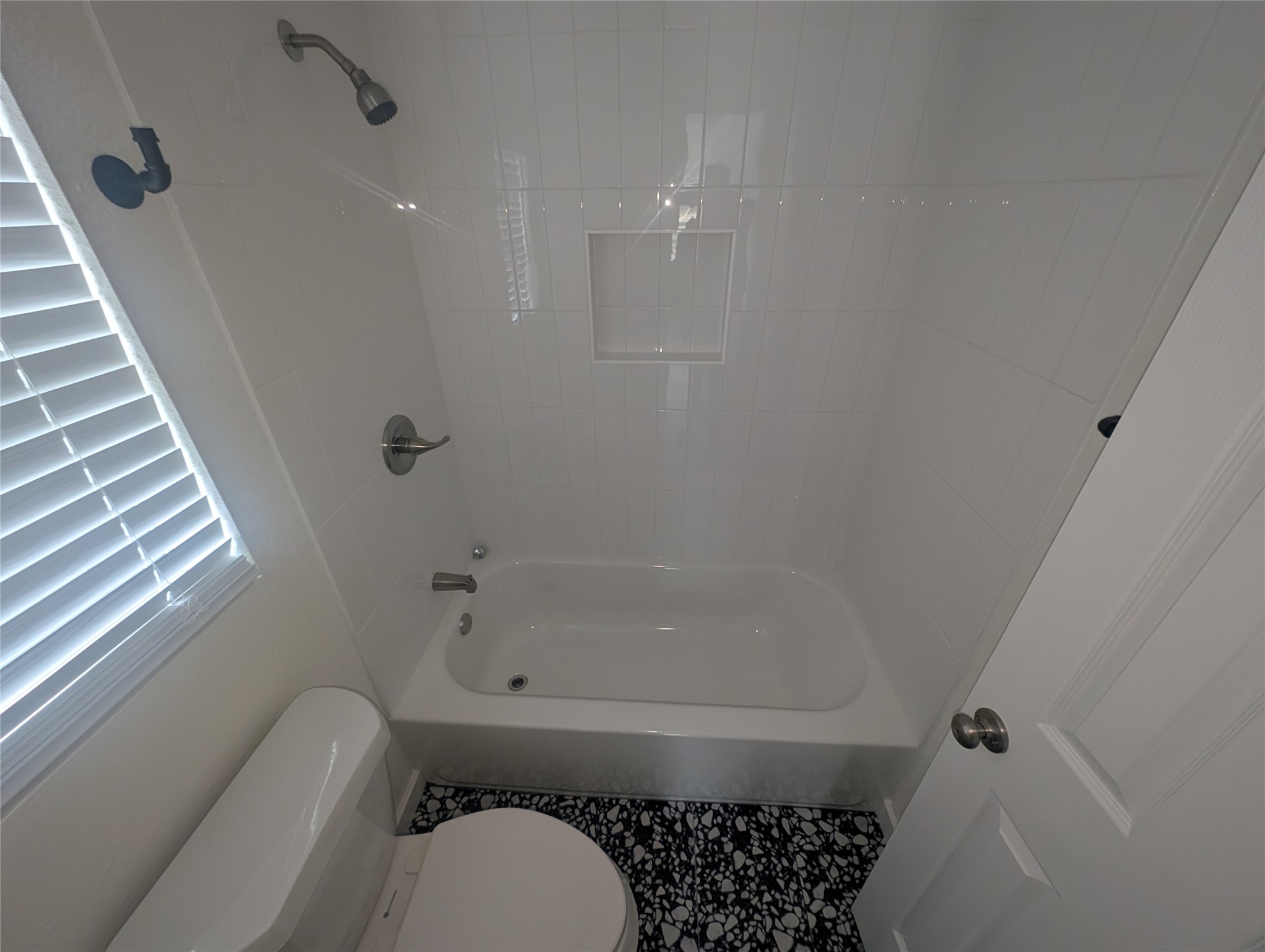 3019 East 12th Street Austin, TX 78702 - Photo 9 of 12 a bathroom with a toilet and a shower