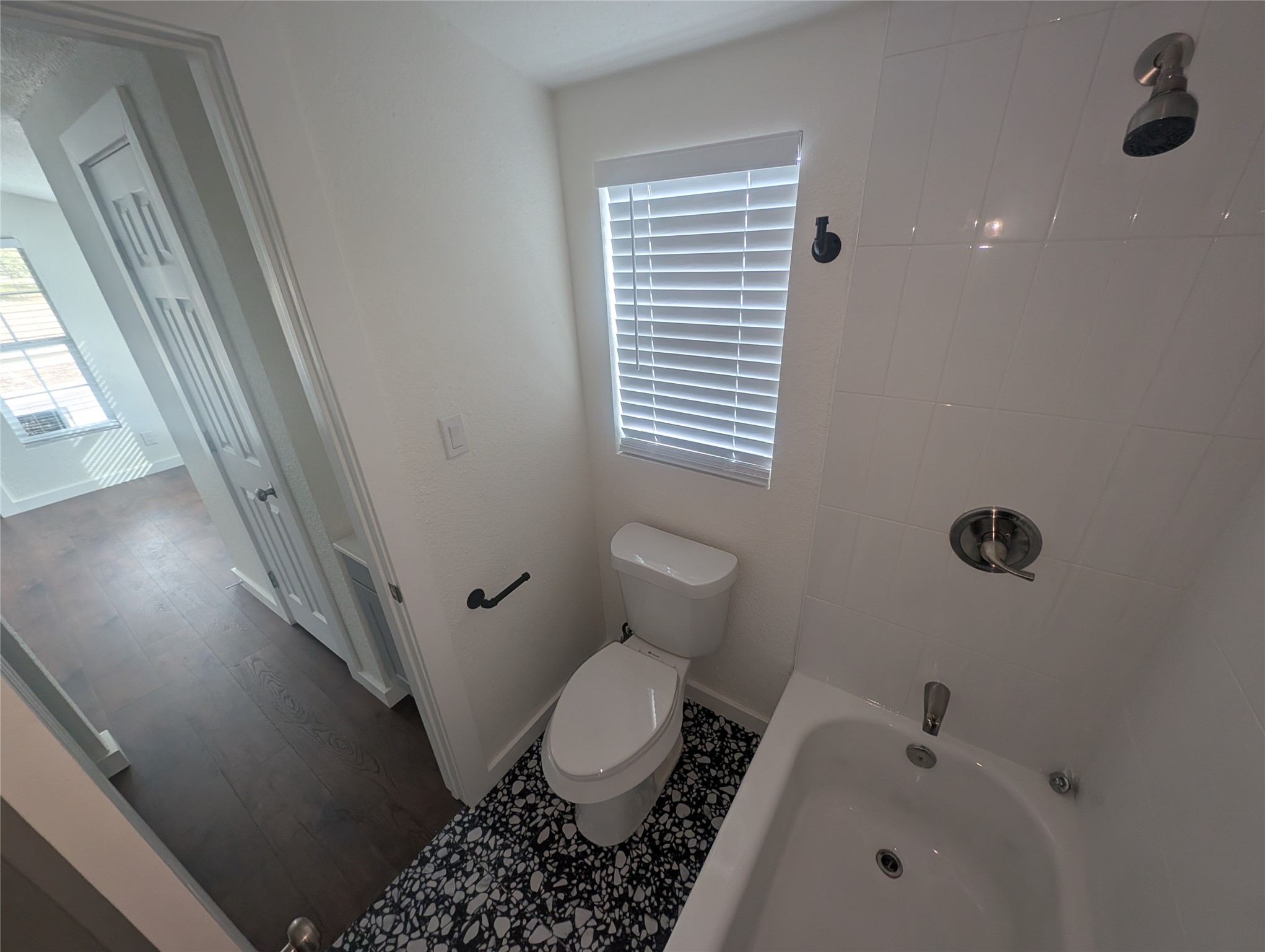 3019 East 12th Street Austin, TX 78702 - Photo 10 of 12 a bathroom with a toilet and a shower