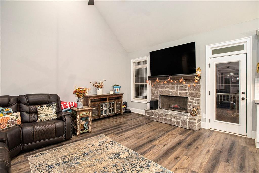 17 Wendover Drive Cartersville, GA 30120 - Photo 11 of 32 a living room with furniture a flat screen tv and a fireplace