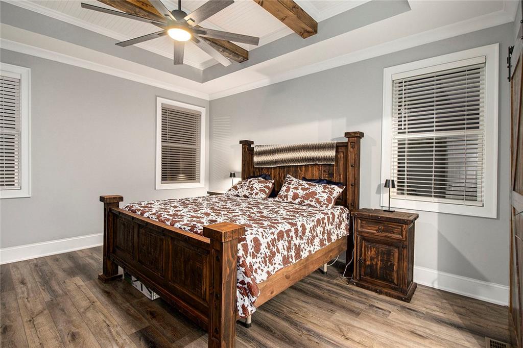 17 Wendover Drive Cartersville, GA 30120 - Photo 16 of 32 a bed sitting in a bedroom next to a window