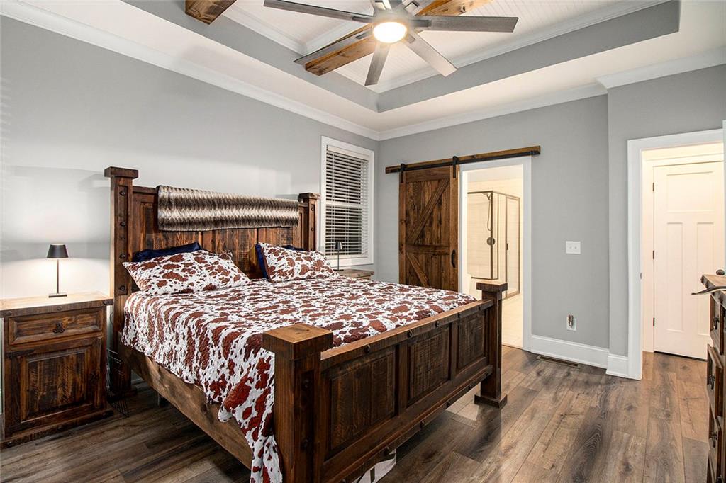 17 Wendover Drive Cartersville, GA 30120 - Photo 17 of 32 a bedroom with a bed and a chandelier