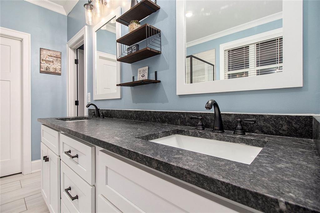 17 Wendover Drive Cartersville, GA 30120 - Photo 20 of 32 a kitchen with stainless steel appliances granite countertop a sink and a granite counter tops