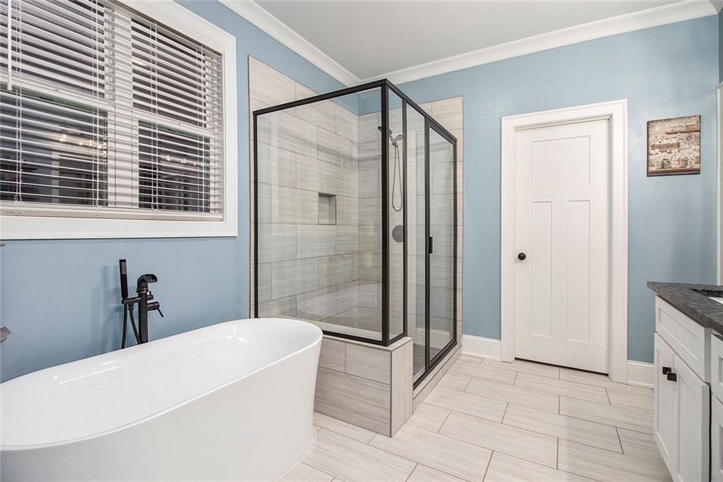 17 Wendover Drive Cartersville, GA 30120 - Photo 21 of 32 a bathroom with a bathtub and a shower