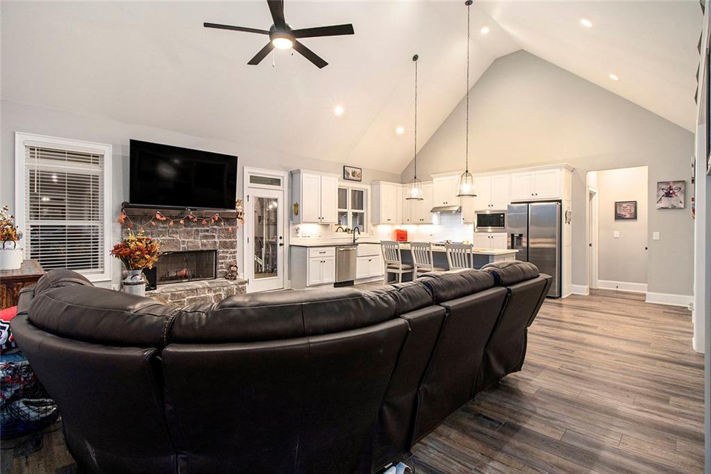 17 Wendover Drive Cartersville, GA 30120 - Photo 10 of 32 a living room with furniture a flat screen tv and a fireplace