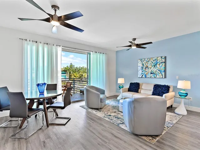 a living room with patio furniture and a window