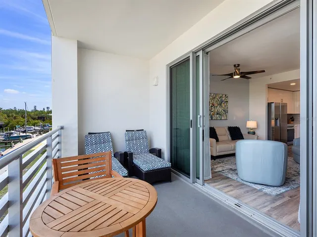 a bedroom with furniture and a rug