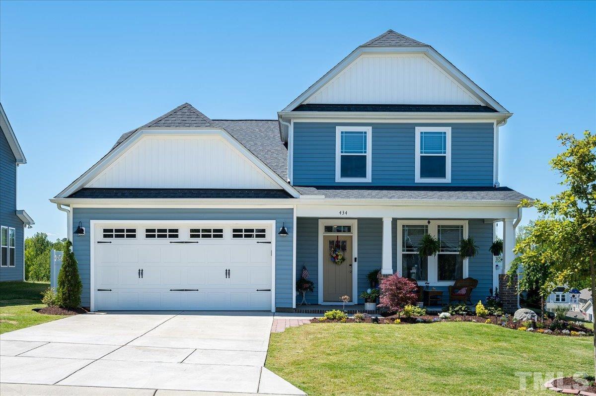 434 Streamliner Boulevard Clayton, NC 27520 - Photo 2 of 27 front view of a house with a yard