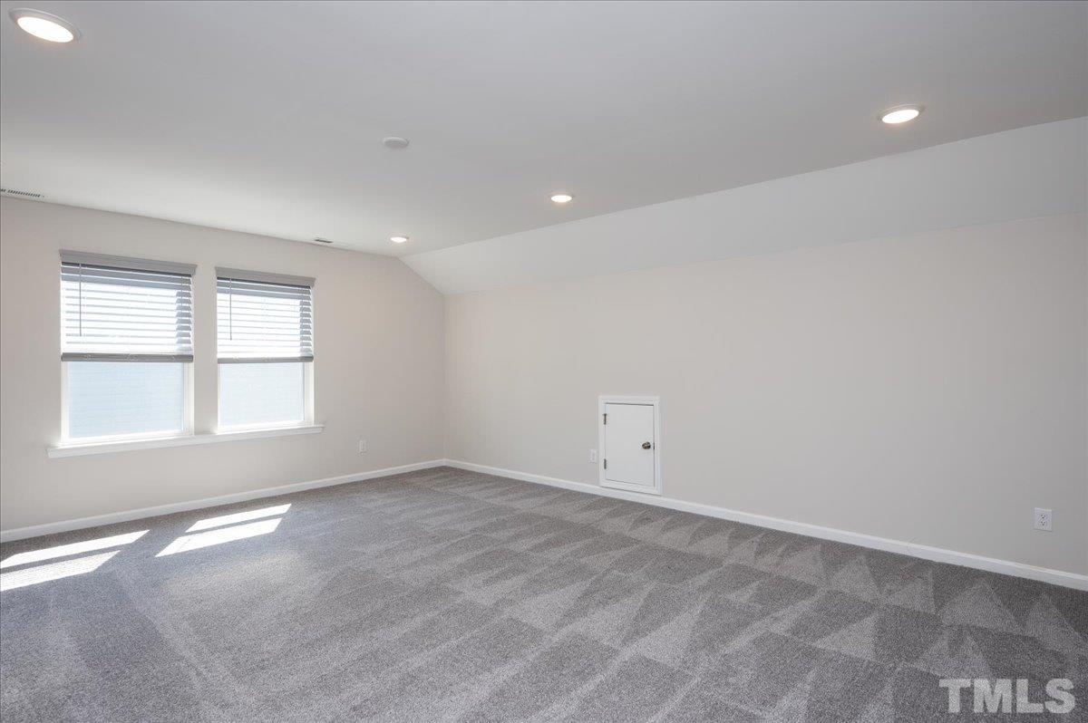 434 Streamliner Boulevard Clayton, NC 27520 - Photo 23 of 27 an empty room with a window