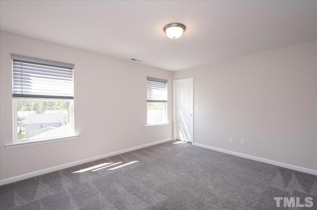 434 Streamliner Boulevard Clayton, NC 27520 - Photo 26 of 27 a view of an empty room with a window