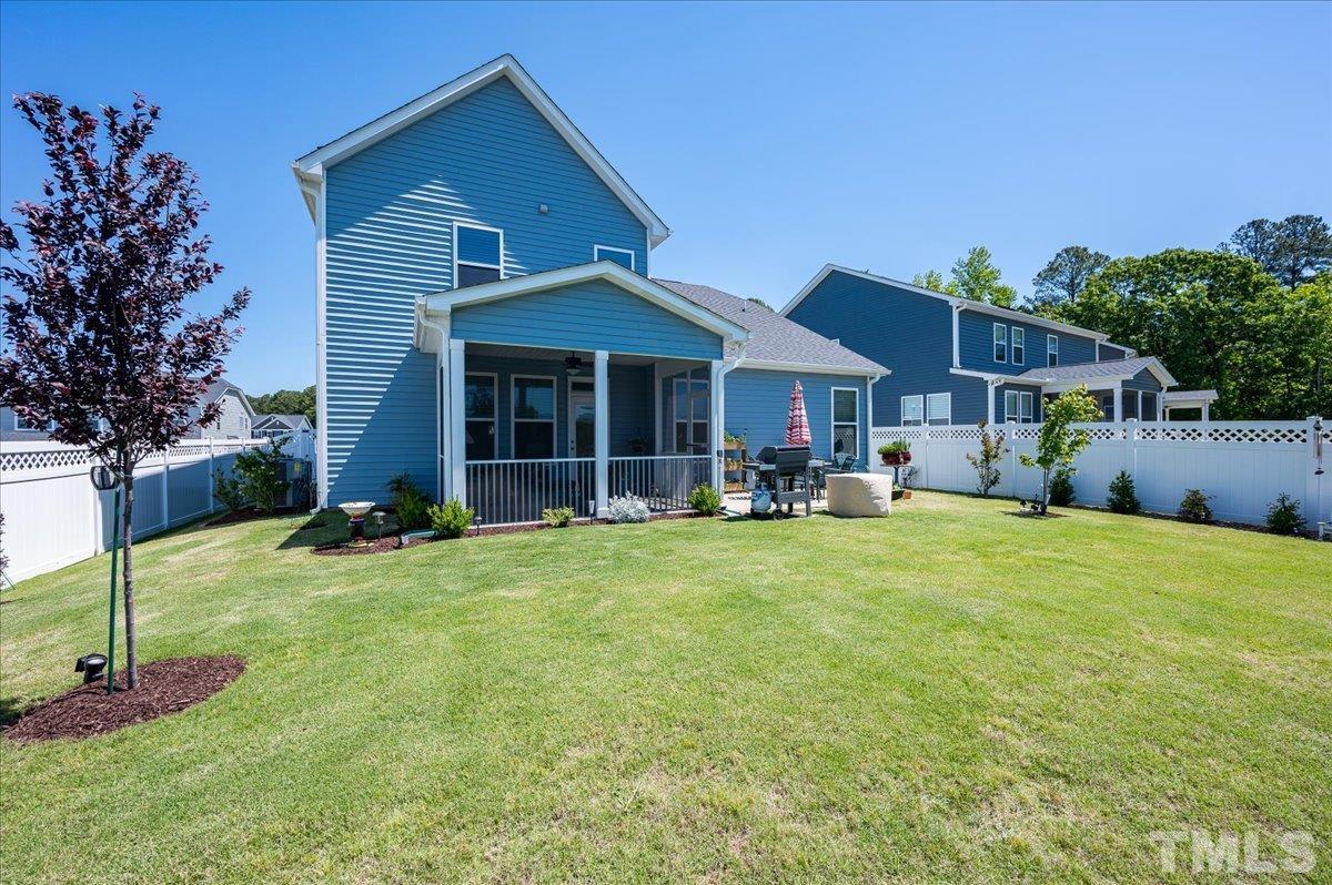 434 Streamliner Boulevard Clayton, NC 27520 - Photo 7 of 27 a front view of a house with a garden and porch