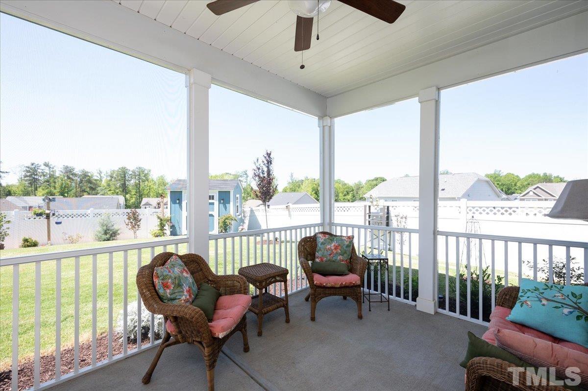 434 Streamliner Boulevard Clayton, NC 27520 - Photo 8 of 27 a living room with furniture and a floor to ceiling window