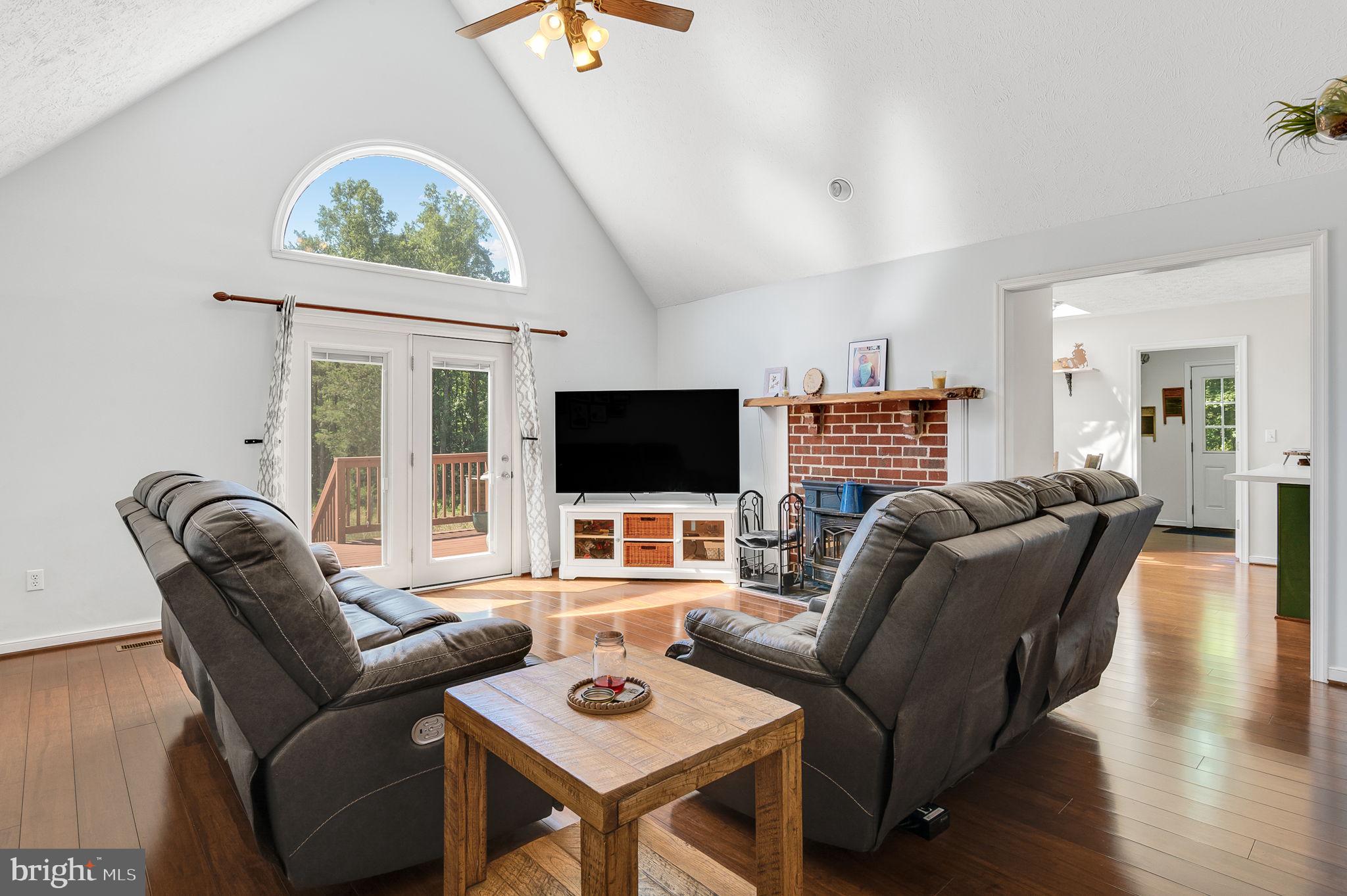 3485 Tabscott Road Columbia, VA 23038 - Photo 3 of 40 a living room with furniture and a flat screen tv