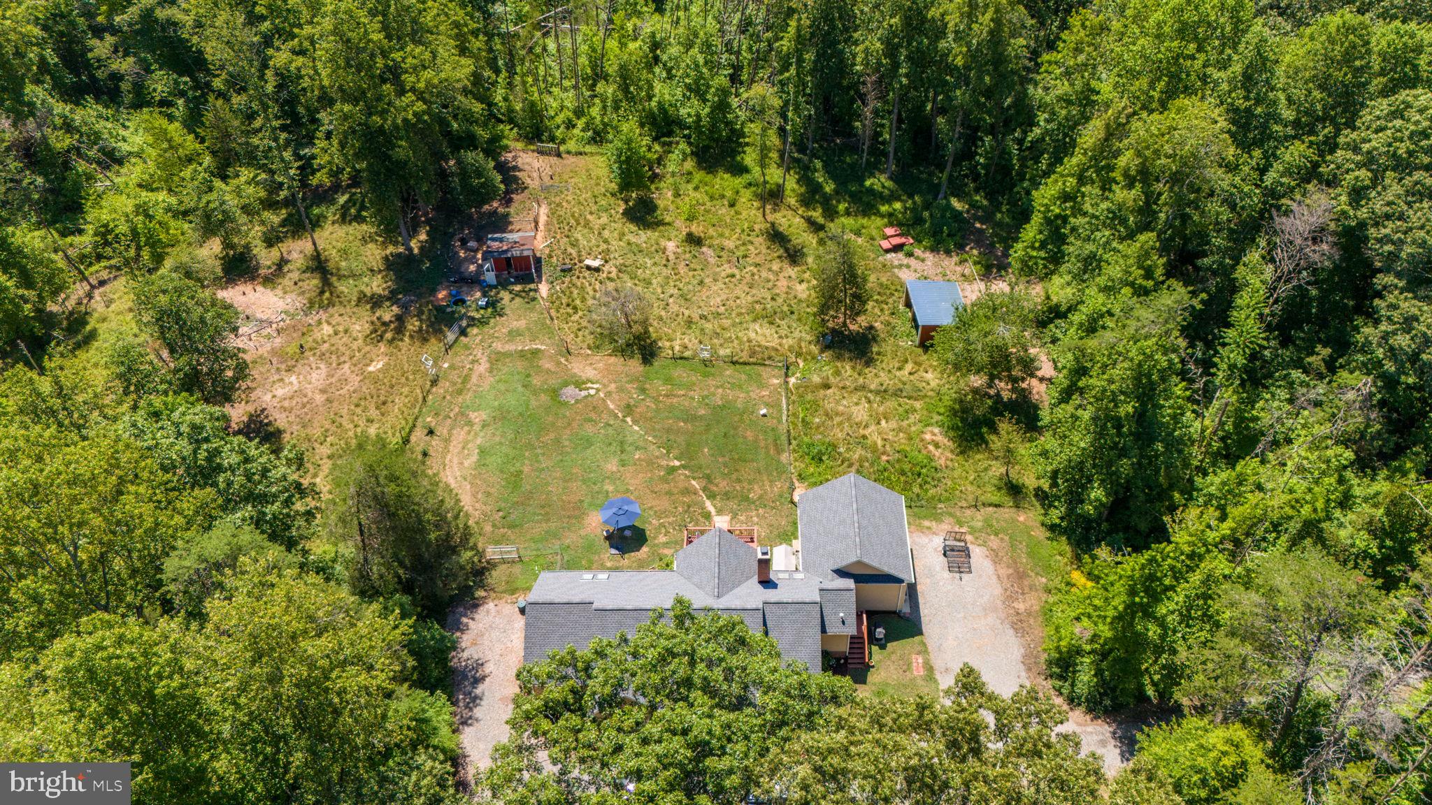 3485 Tabscott Road Columbia, VA 23038 - Photo 32 of 40 an aerial view of a house with a yard and large trees