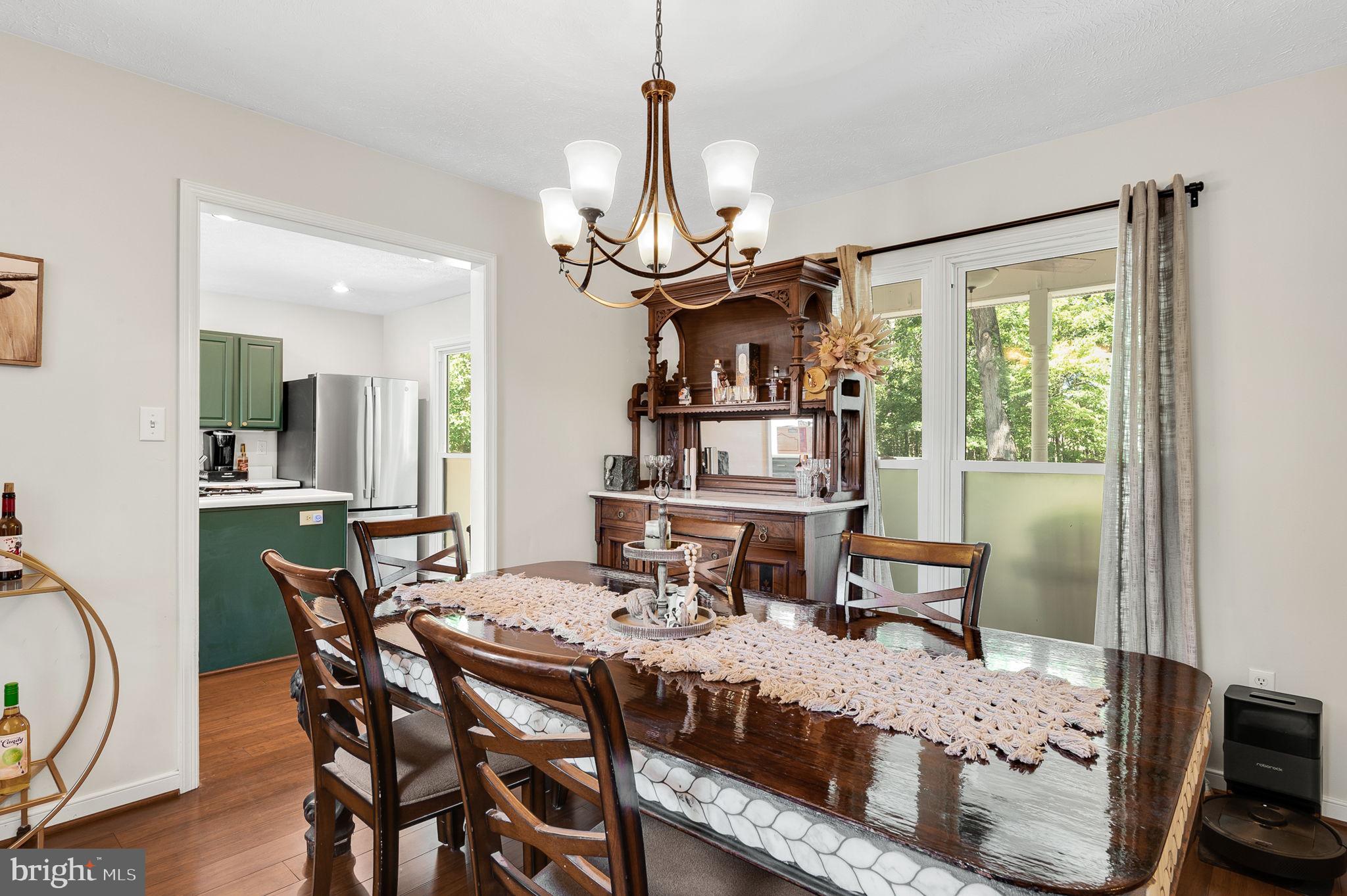 3485 Tabscott Road Columbia, VA 23038 - Photo 8 of 40 a view of a dining room with furniture window and outside view