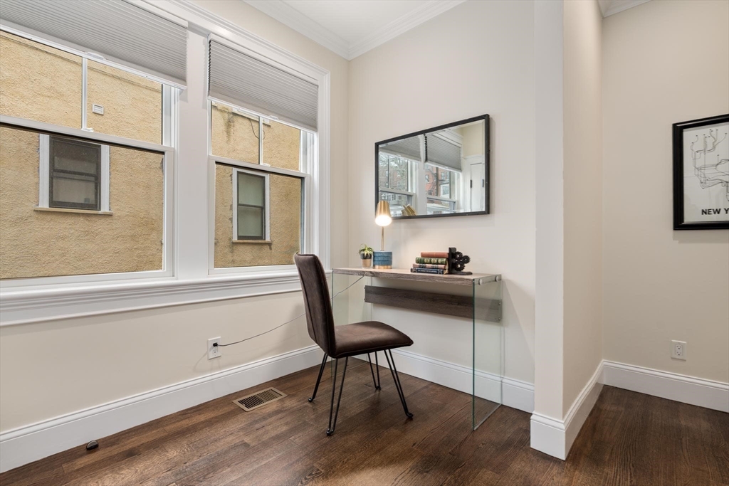 197 Rawson Road, Unit 1 Brookline, MA 02445 - Photo 17 of 27 a view of a workspace with furniture and a window