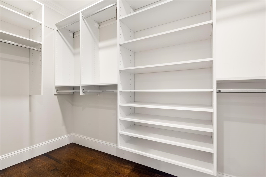 197 Rawson Road, Unit 1 Brookline, MA 02445 - Photo 19 of 27 a view of walk in closet with empty racks