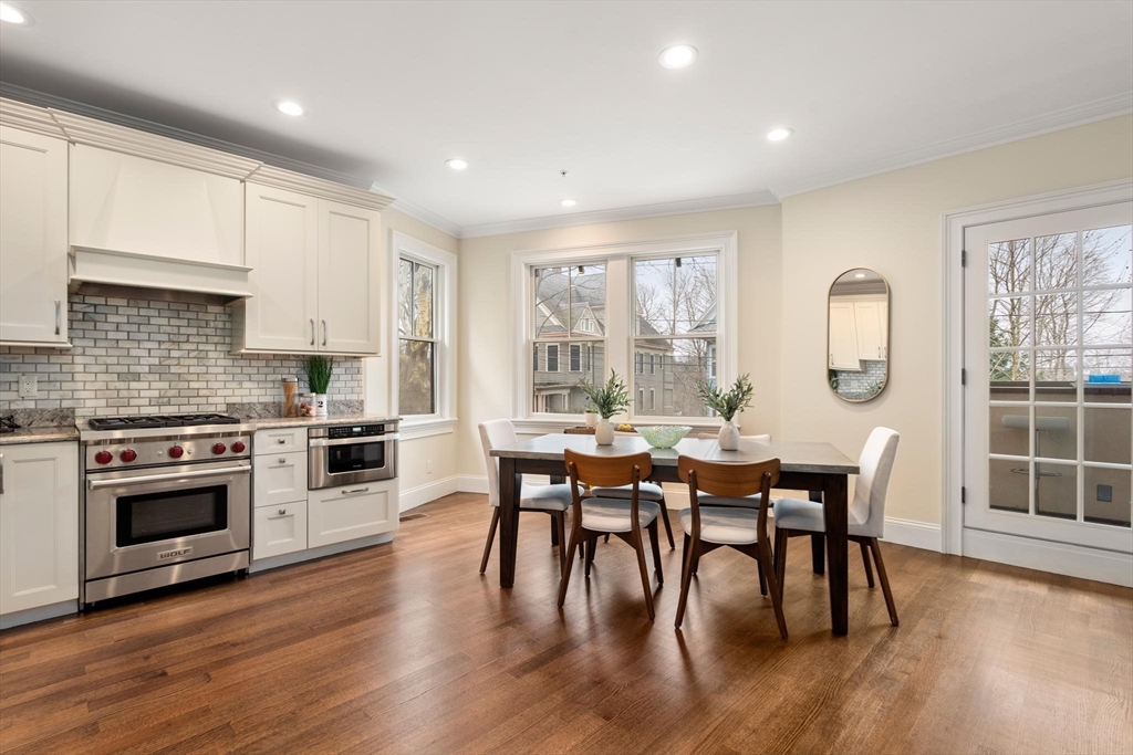 197 Rawson Road, Unit 1 Brookline, MA 02445 - Photo 6 of 27 a view of a dining room with furniture window and wooden floor