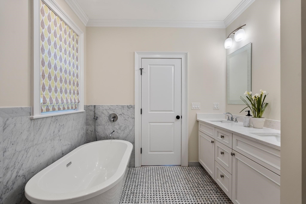 197 Rawson Road, Unit 1 Brookline, MA 02445 - Photo 10 of 27 a bathroom with a bathtub shower sink and toilet