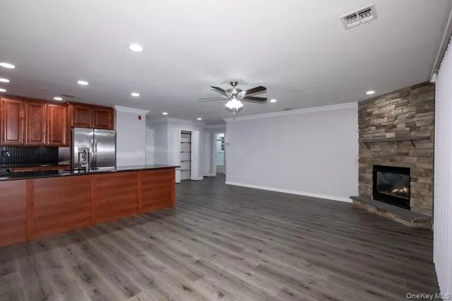 a view of kitchen with cabinets and wooden floor