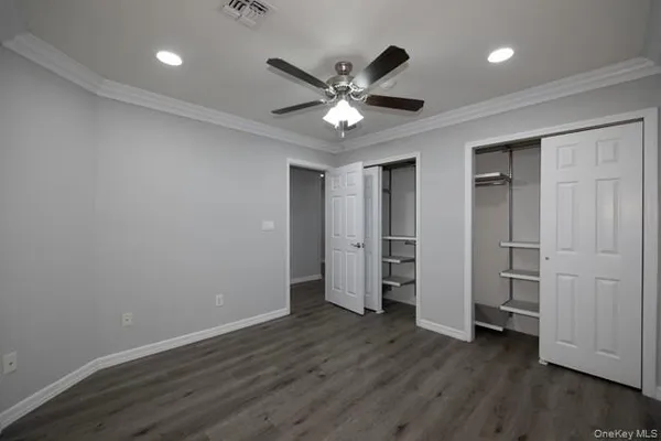 a view of an empty room and wooden floor