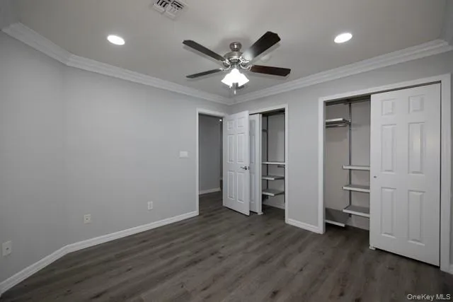 a view of an empty room and wooden floor
